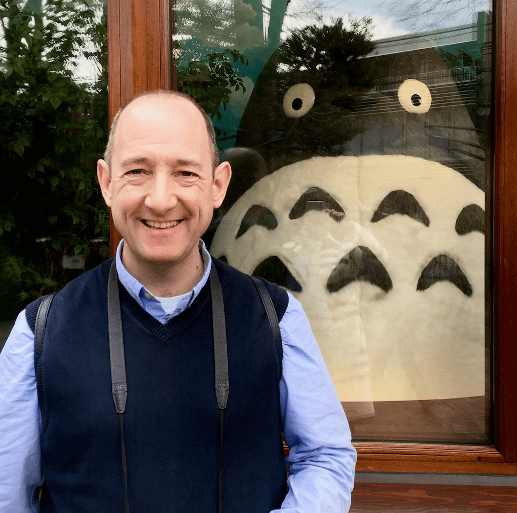 Matthew with a Totoro Plushie